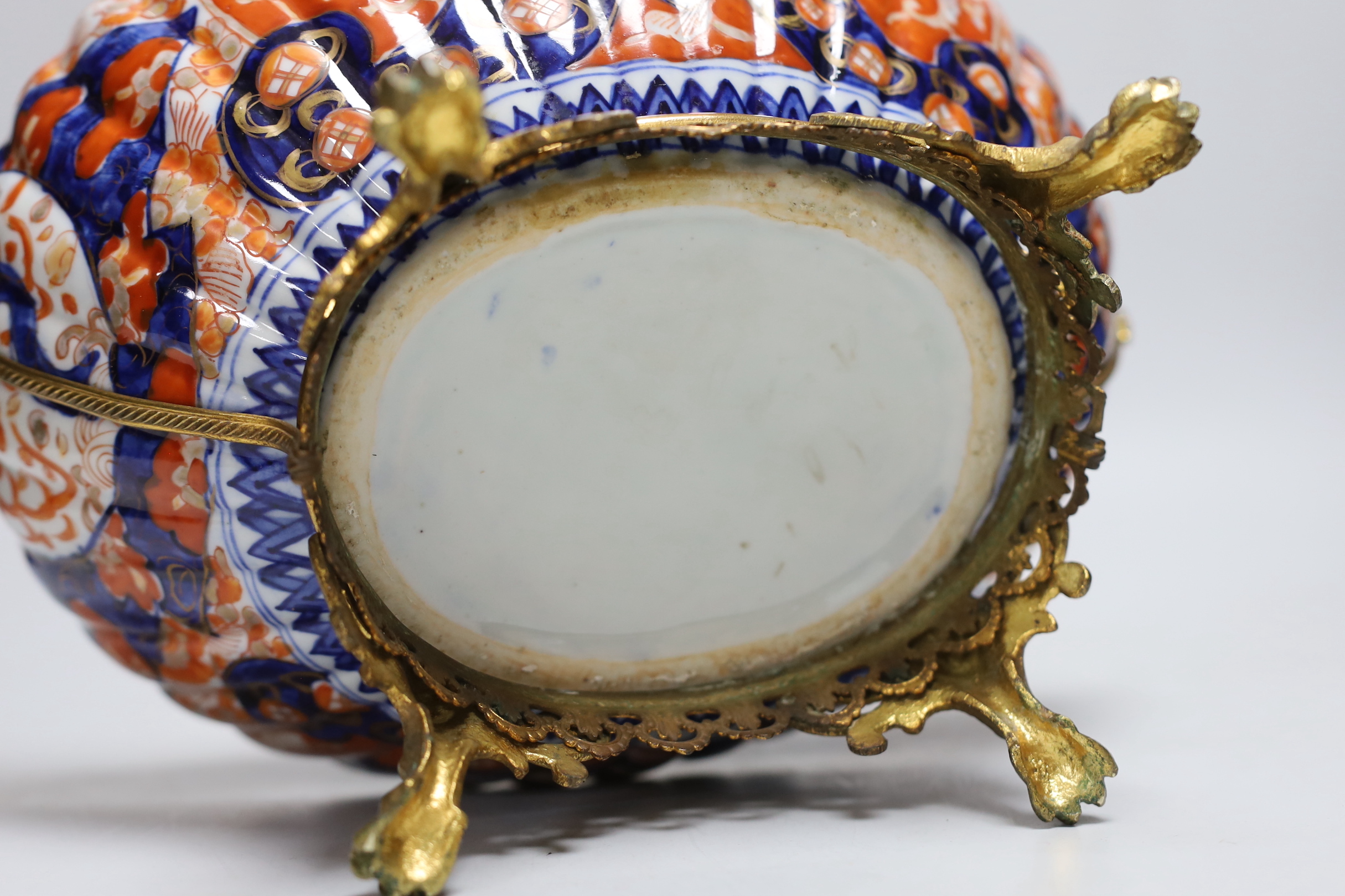 An Imari planter with ornate brass mounts and handles, 24cm high base to top of handles